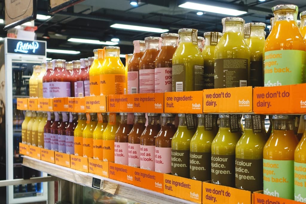 Supermarket shelves stocked with bottles